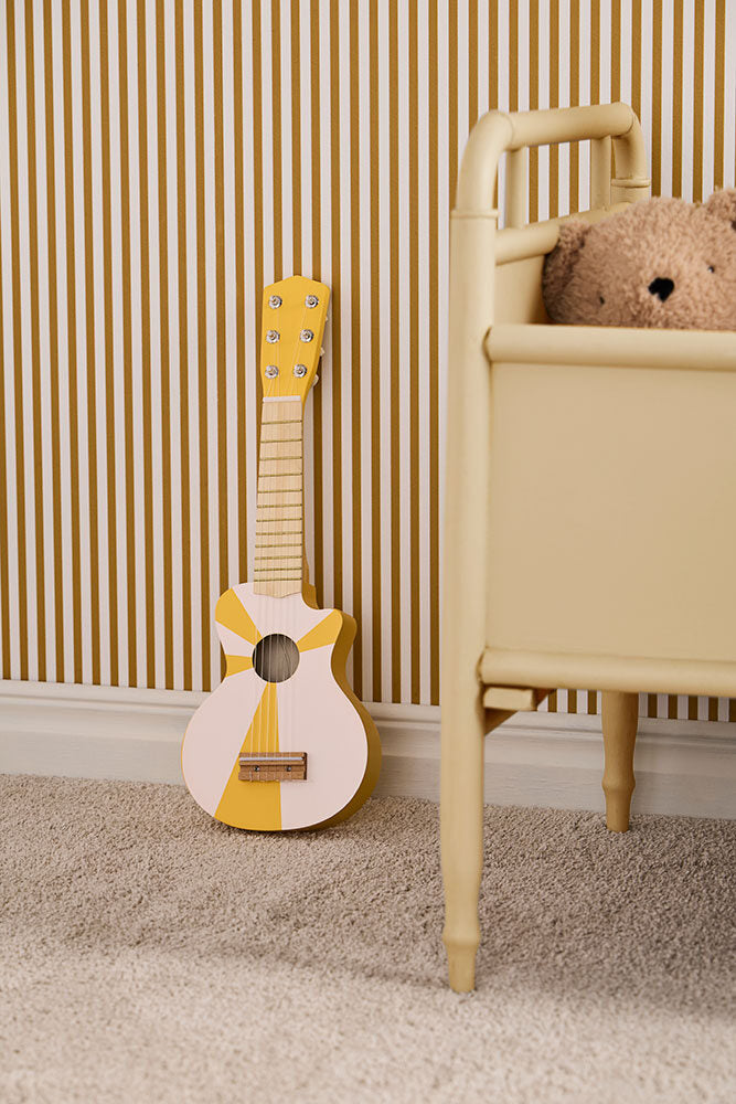 Toy guitar yellow white